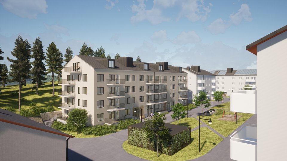 Vita flervåningshus med balkonger svarta tak.