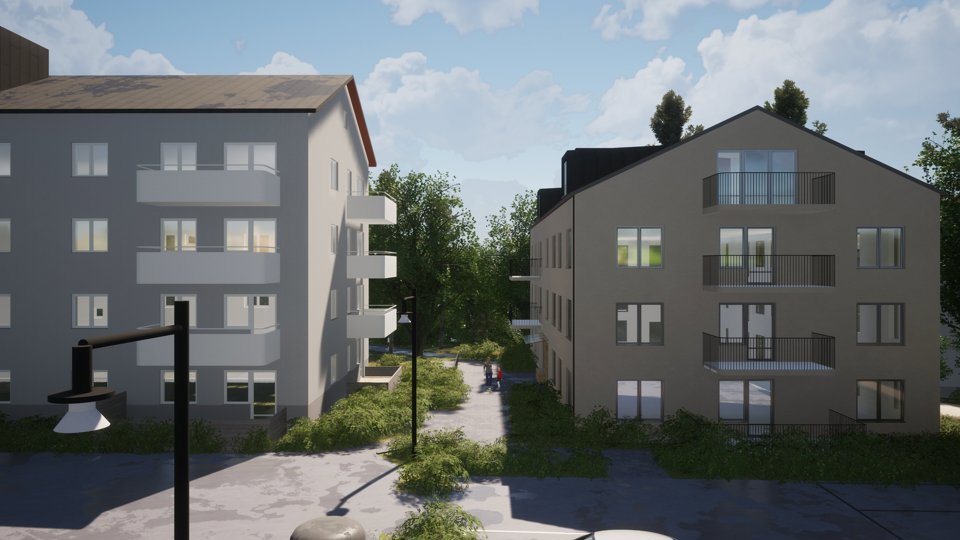 Vita flervåningshus med balkonger svarta tak.