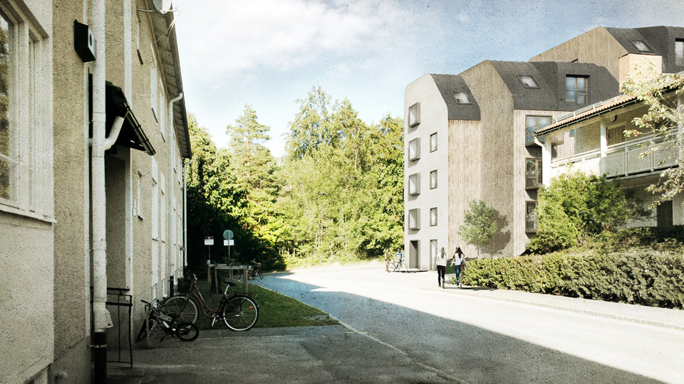 Två flerbostadshus med en gångväg emellan.