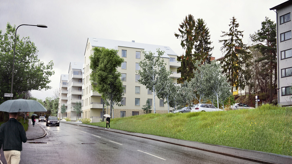 Gatuvy med promenerande människor med paraply, längs en gata med bostadshus.