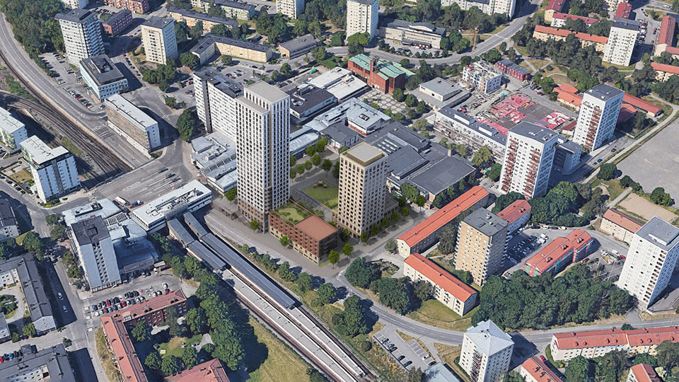 Flygbild över Högdalens centrum mot sydväst. Den föreslagna bebyggelsen i mitten, mellan Sjösavägen, Högdalsgatan och Rangstagatan. Ett torg med grön yta inramat av ny bebyggelse mot Rangstagatan och Sjösavägen. Ett högt punkthus mot tunnelbanestationen och centrum. Ett lite lägre punkthus mot Rangstagatan. 