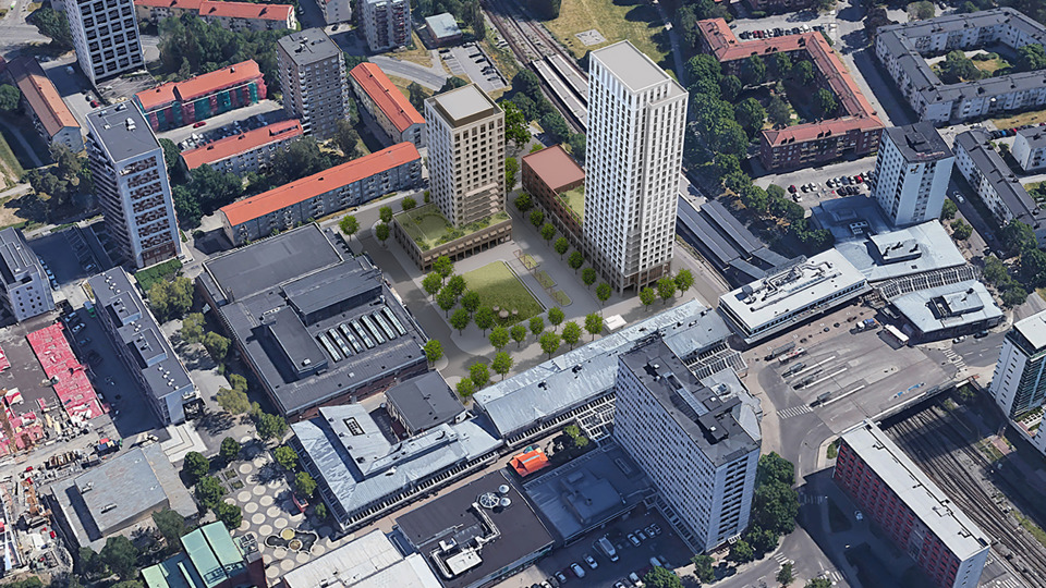 Flygbild över Högdalens centrum från sydväst. Den föreslagna bebyggelsen i mitten, mellan Sjösavägen, Högdalsgatan och Rangstagatan. Ett torg med grön yta i mitten inramat av ny bebyggelse mot Rangstagatan och Sjösavägen. Ett högt punkthus mot tunnelbanestationen och centrum. Ett lite lägre punkthus mot Rangstagatan. 