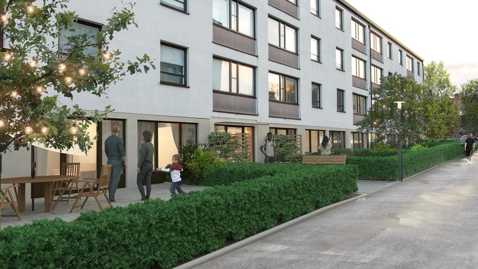 Bostadshus med grönskande förgårdar. 