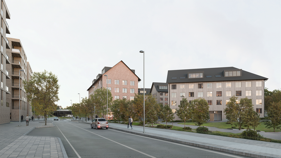 Gata med flerbostadshus i tegel i förgrunden. 