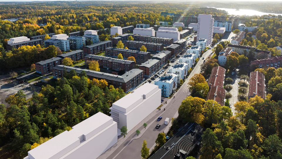 Flygvy över planområdet med hus i vitt och befintliga hus och natur runt omkring dem. 