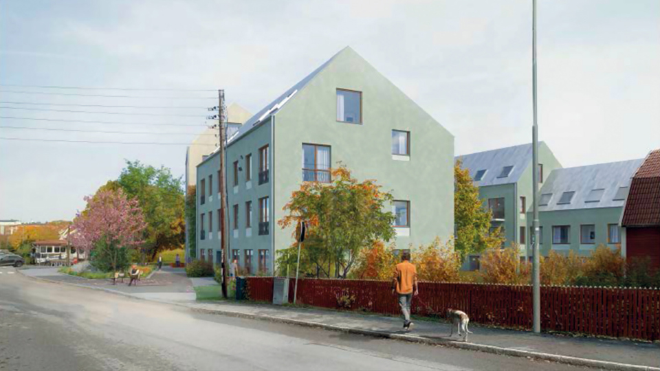 Ett flerbostadshus i ljust grön färg vid en gata. Staket, träd, andra bostadshus och trottoar. Illustration.