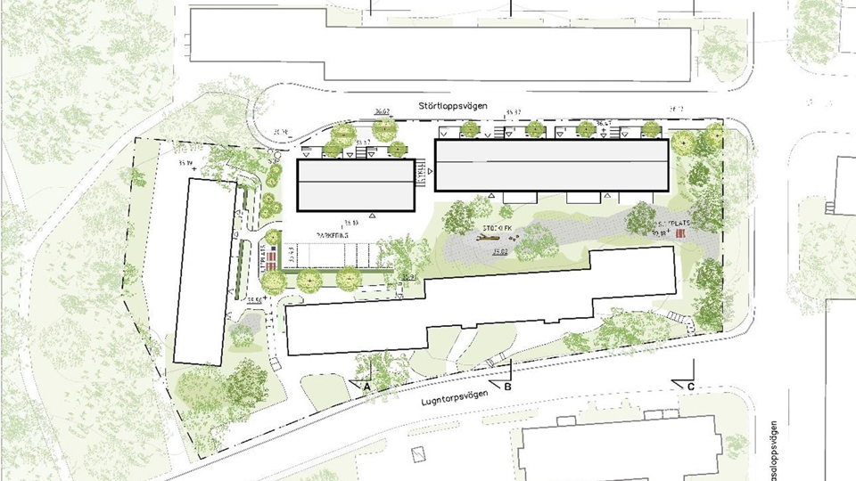 Karta med planerad bebyggelse markerad, tillsammans med andra byggnader och grönområden runtomkring. 