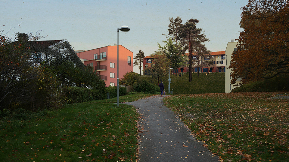 Parkväg som leder upp till bostadsområde. En person som promenerar, foto.