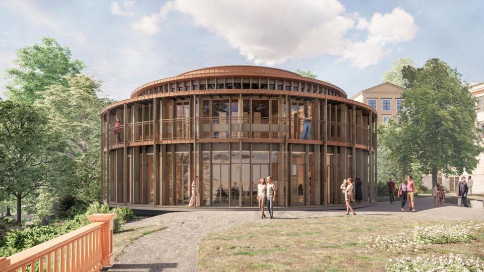 Rund byggnad med fasad av träribbor, över bottenvåningen syns balkonger längs fasaden, illustration.