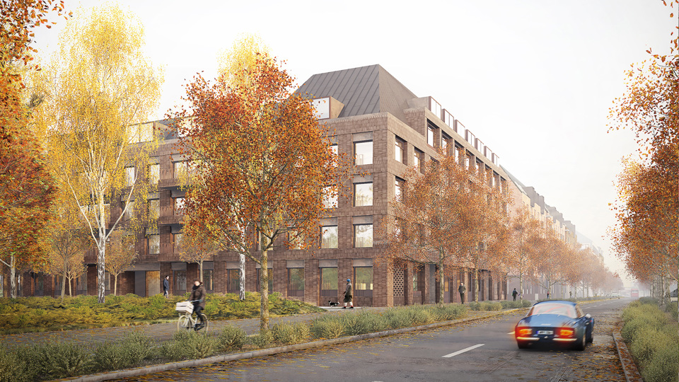 Träd i höstfärger framför ett flerbostadshus.