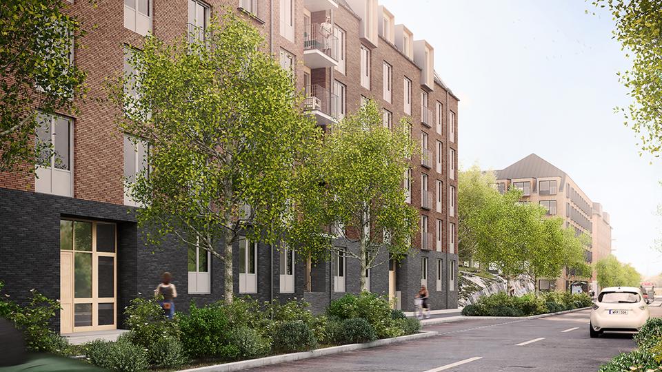 Flerbostadshus med träd framför.