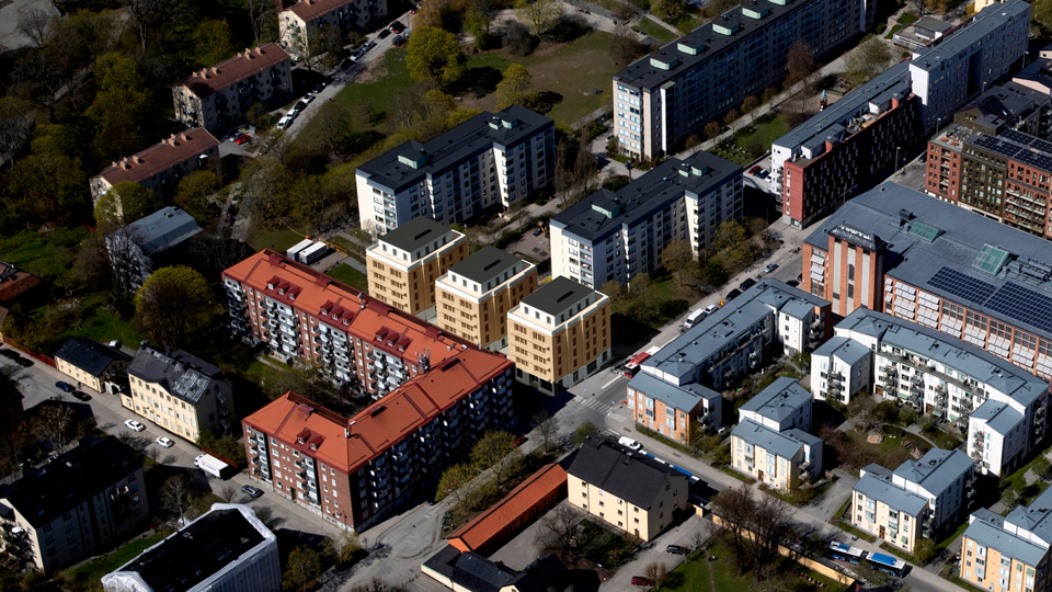 Flygvy över området med ny bebyggelse, fotomontage.