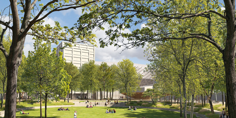 Visionsbild över Centrala parken i Slakthusområdet med stor rund gräsmatta och sittgradänger och trädplanteringar runt om. Illustration: Nyréns arkitekter