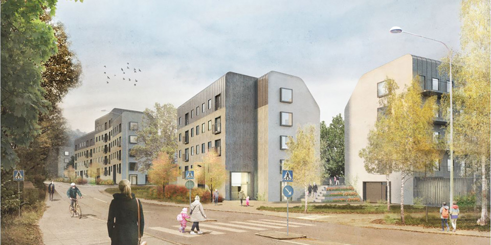 Människor går på en gata, flerbostadshus finns längs gatan.