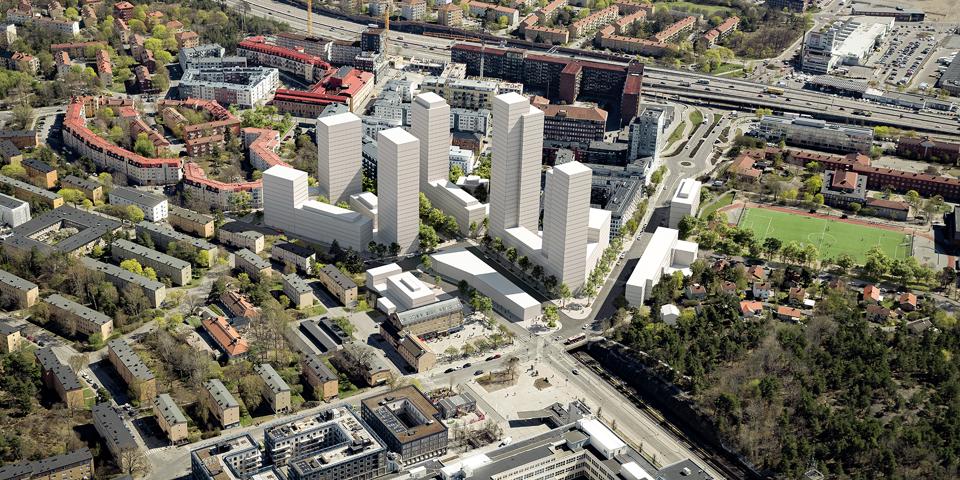 Flygvy över planområdet sett från sydost, med föreslagen bebyggelse. Västbergaskogen syns i nedre högra hörnet, fotomontage.
