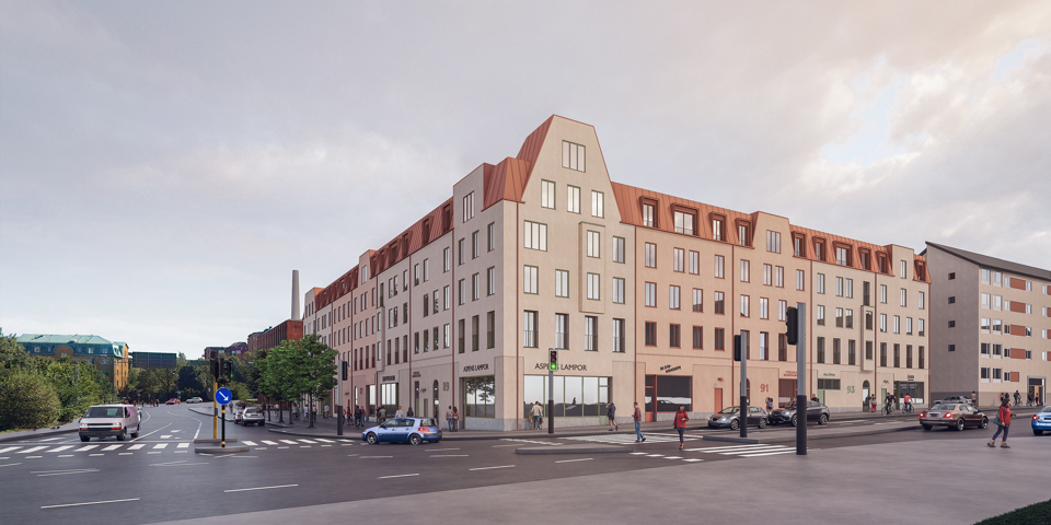 Ett ljust putsat flerbostadshus i hörnet av en korsning. Huset har orangerött plåttak som går ner över de översta fönstren. I korsningen har huset en uppstickande del som ett gavelmotiv. I bottenvåning finns verksamhetslokaler, på visionsbilden står exempelskyltning ovanför lokalerna.