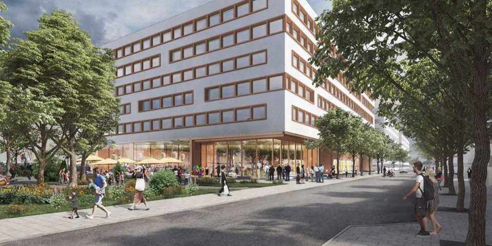 Människor som passerar ett vitt kontorshus med fönster i långa rader och en inglasad entré.