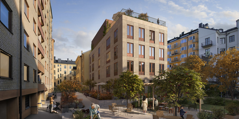 Flera flerbostadshus och en gård med träd och utemöbler.