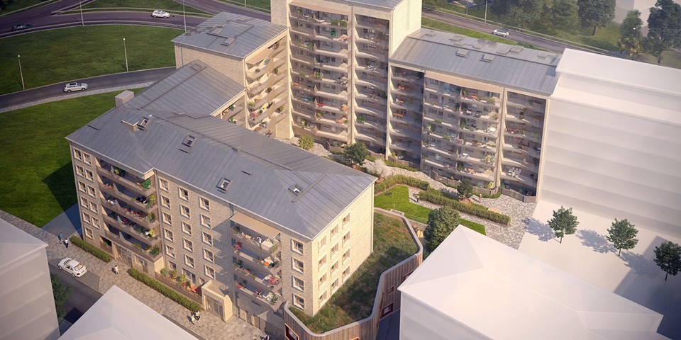 Flygbild som visar ett bostadsområde med lägenheter och innergård med grönytor och träd, illustration.