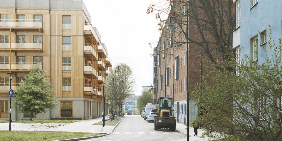 Vy längs med gata med omgivande bostadshus i stadsmiljö, fotomontage.