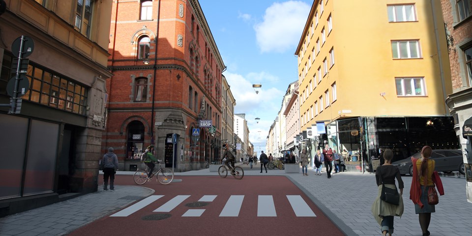 Rödfärgad bred cykelbana på Götgatan som svänger in på Högbergsgatan, visionsbild.