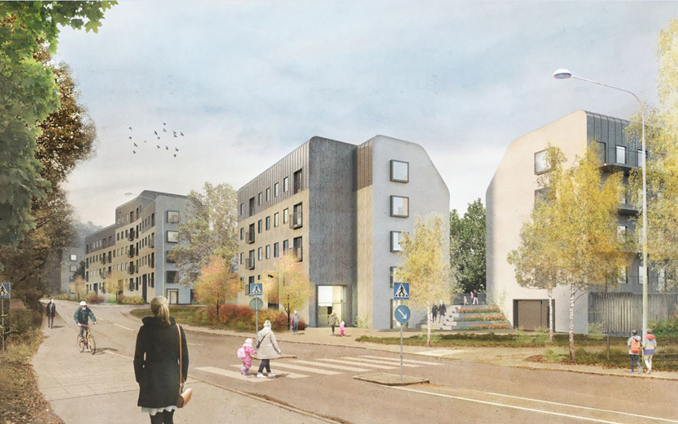 Människor går på en gata, flerbostadshus finns längs gatan.