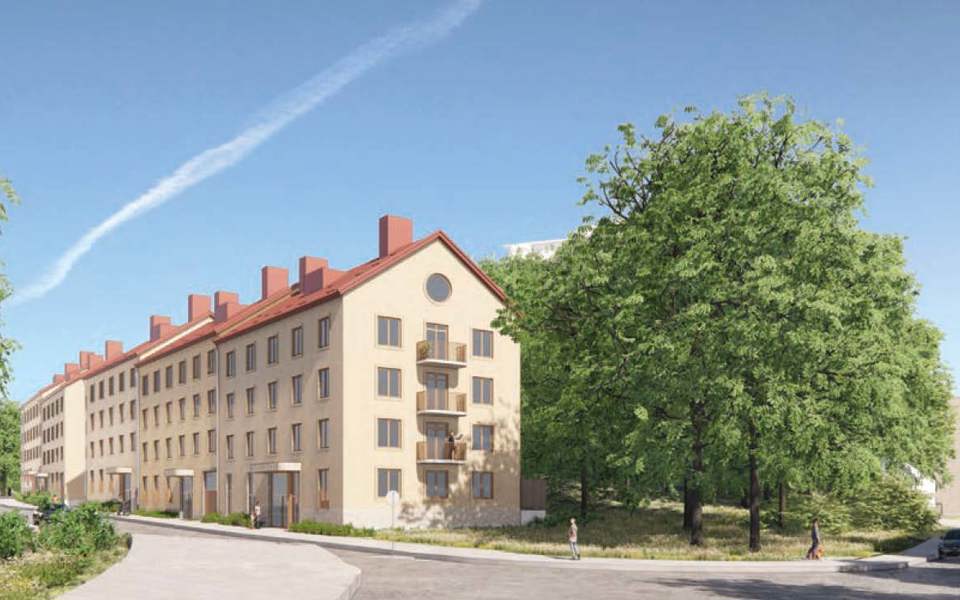En rad med ljusgula bostadshus i fem våningar med tegelrött tak