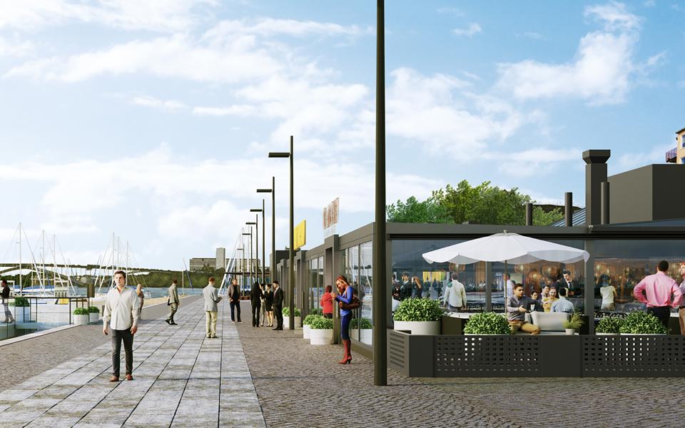 Restauranger som ligger vid vattnet. Människor som är på restaurangerna och som promenerar på kajen. Visionsbild.