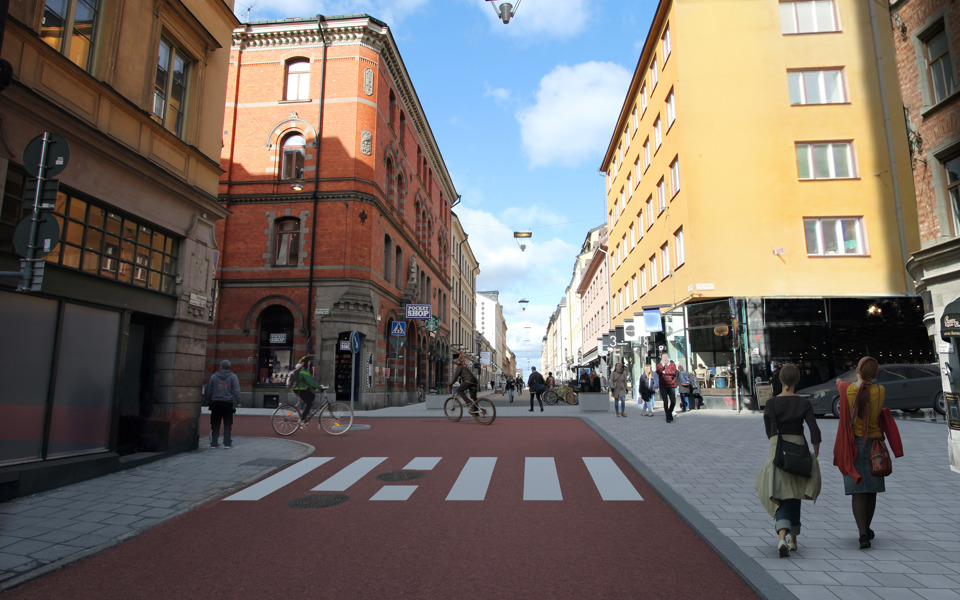 Rödfärgad bred cykelbana på Götgatan som svänger in på Högbergsgatan, visionsbild.