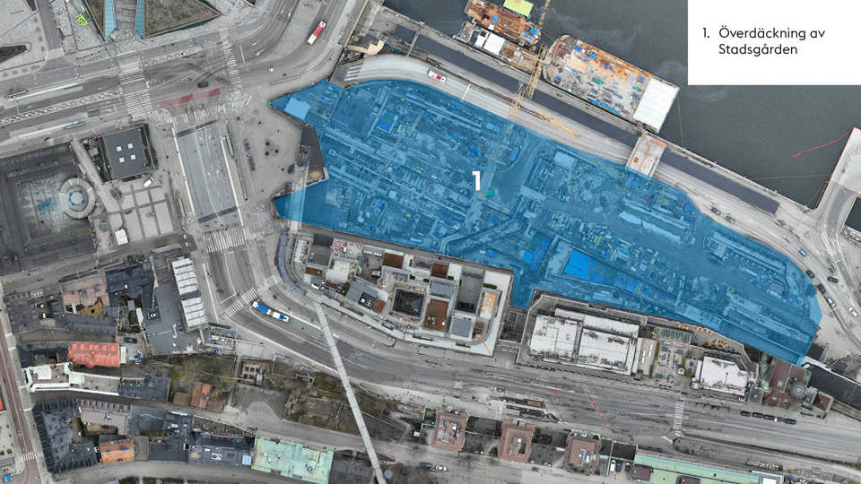 Flygbild över Slussenområdet. Blå markering visar var arbete med överdäckning av Stadsgården pågår.
